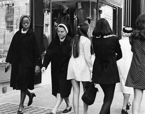 Nuns pass girls in mini skirts