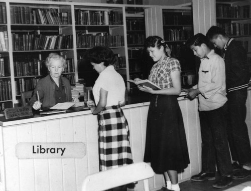 Navajo students in library at Sherman Institute