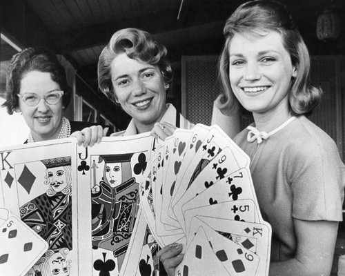 Tarzana Aides display placemats for fund-raising party and luncheon