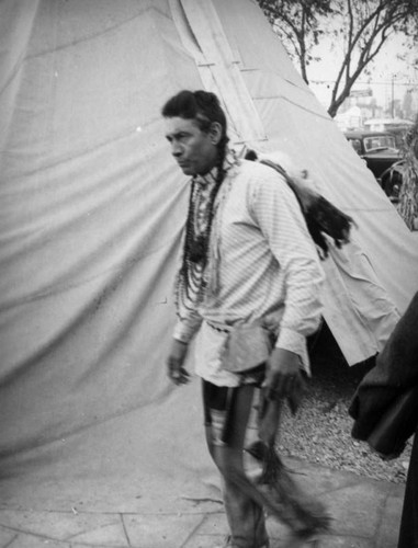 Walking by a tepee at the Farmers Market Fall Festival