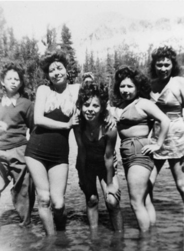 Mexican American women in mountain stream