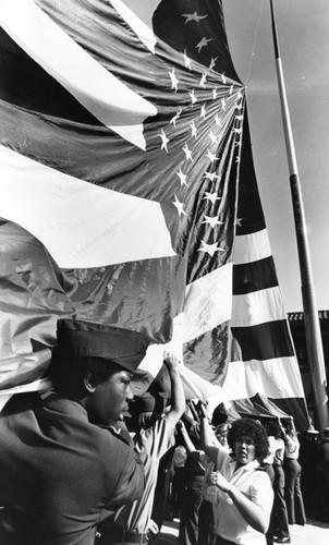 Hostage supporters carry flag