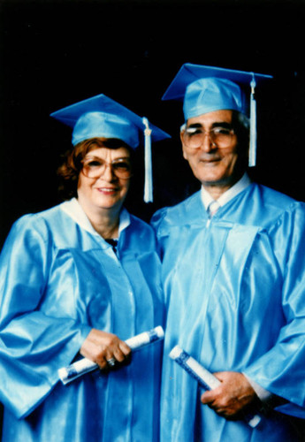 Elderly couple in cap and gown