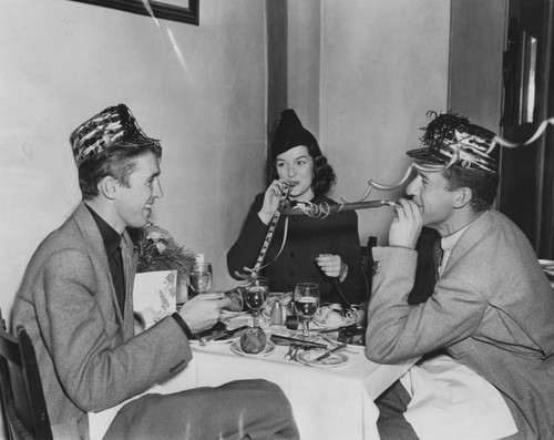 Jimmy Stewart, John Swope and Rosalind Russell have party at Lake Arrowhead Lodge