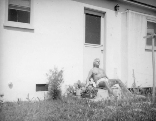 Herman Schultheis on the steps at home