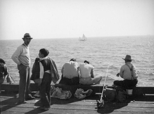 Father and son on a Newport Beach pier