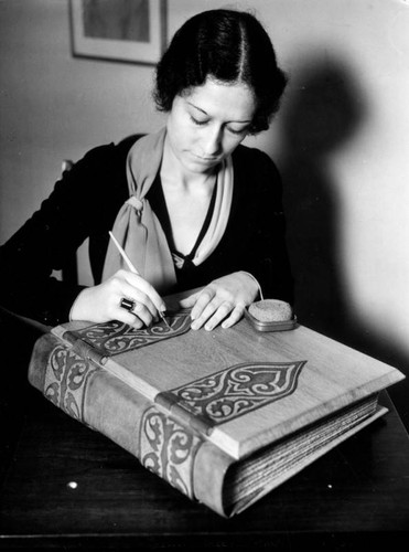 Young woman with a library book