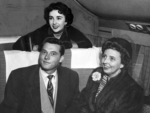 Liz Taylor and fiance fly east