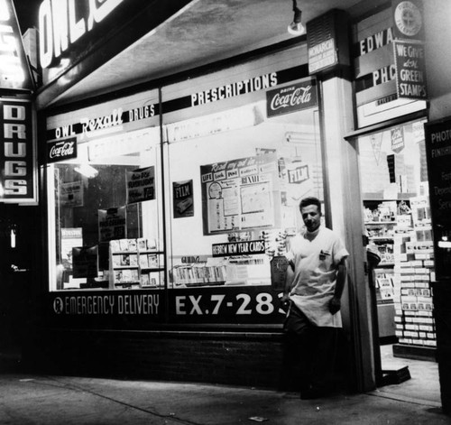 Norman Steinman in front of his drug store