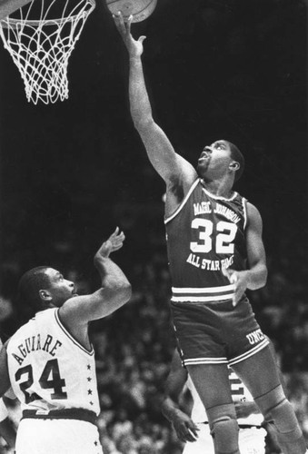 Mark Aguirre and Magic Johnson at a charity All-Star game