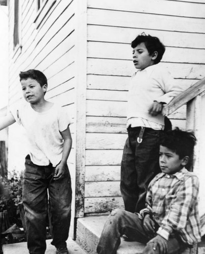 Close-up view of three young boys, Chávez Ravine