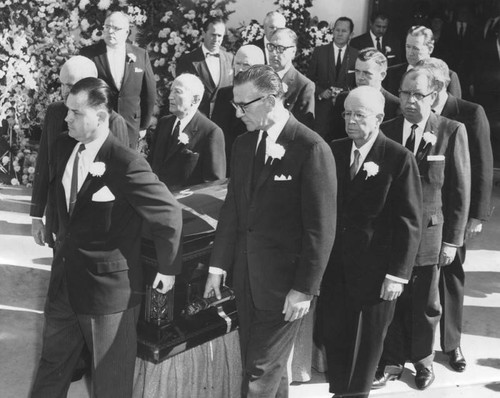 Pallbearers carry Cecil B. DeMille's casket