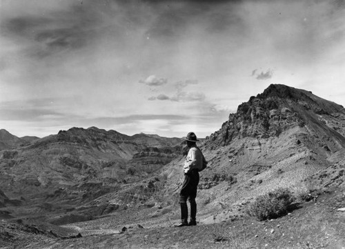 Park ranger overlooking formation approaching Titus Canyon