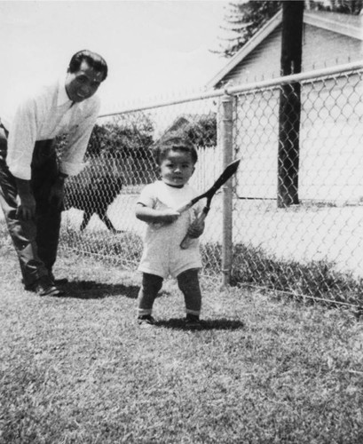 Child with hedge clippers