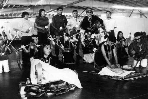 Navajos grinding corn