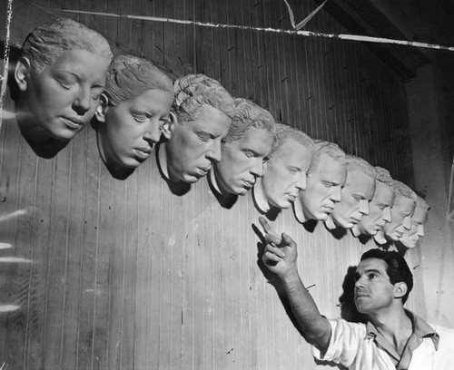 Makeup artist Steven Clensos with masks