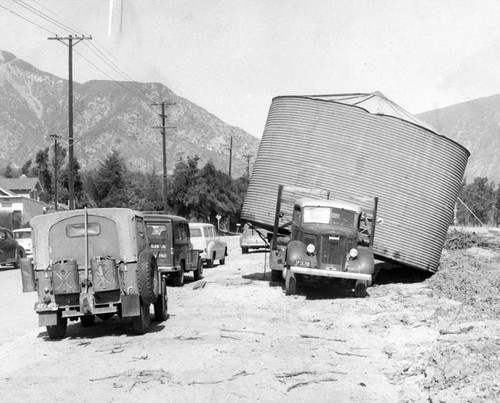 Wind shoves tank off truck