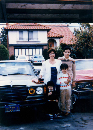 Family in their driveway