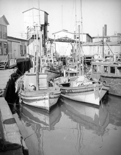 Boats docked by a repair shop at Terminal Island