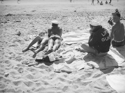 Lifeguards relaxing at Newport Beach