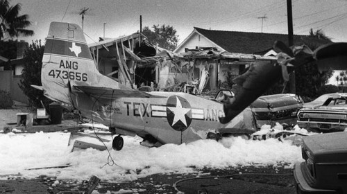 Vintage fighter plane crashes into house