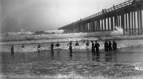Swimming by the Long Beach pier
