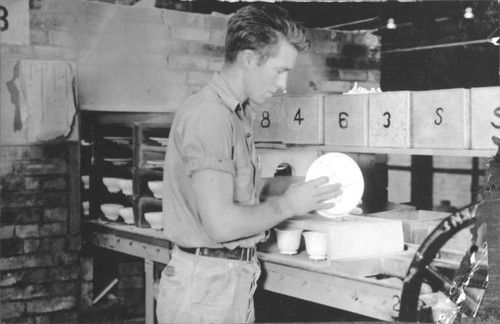 Worker in a ceramics factory