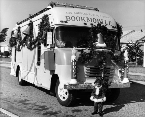 Mini Santa in front of a Bookmobile