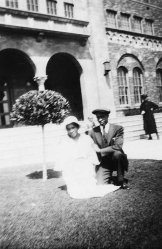 Couple in front of school