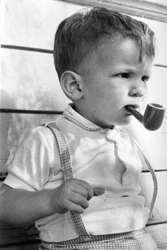 A boy and his pipe - one puff is enough