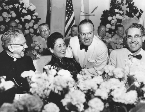 Madame Chiang Kai-Shek enjoys Bob Hope's quips at Bar Association dinner