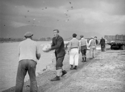 Unloading a truck, El Monte hog farm flood