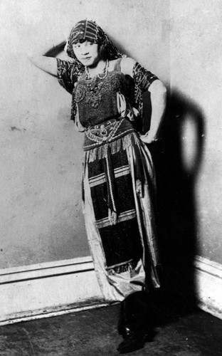 Woman in a beaded and fringed dress