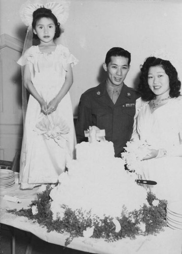 Bride, groom and cake