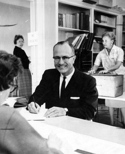 Dr. Max Rafferty signs in at La Canada polling place