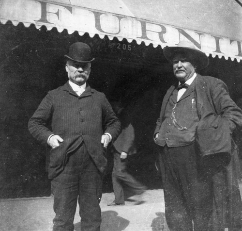 Men in front of furniture store