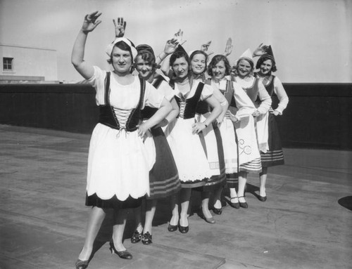 Seven women in folk costumes