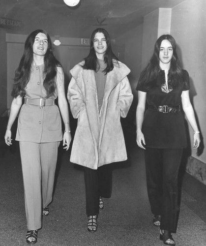 Three female defendants on their way to court — Calisphere