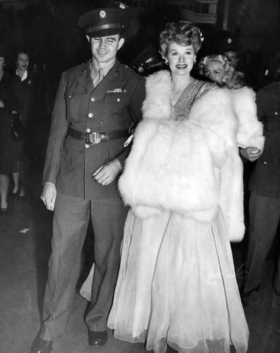 Lucille Ball with guest at premiere