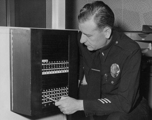 Police officer at switchboard
