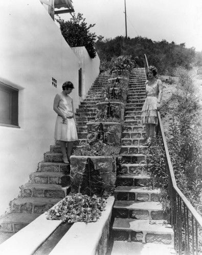 Two women on stone steps