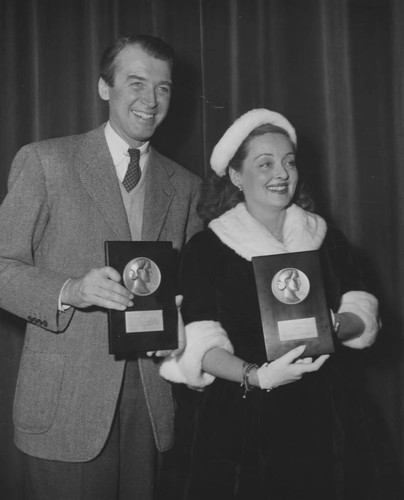 Jimmy Stewart and Bette Davis receive Look Magazine Film Achievement Awards