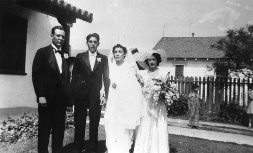 Mexican American couple and wedding party