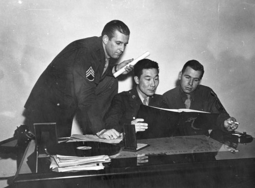 Korean American soldier at desk