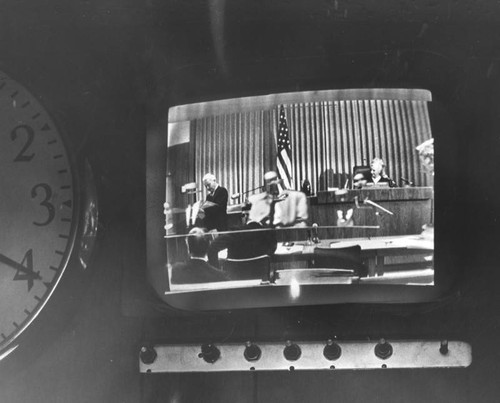 View of the general court scene on a television screen