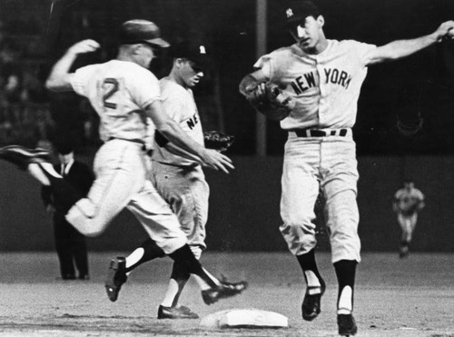 Yanks' Joe Pepitone leaps across first base after tagging bag at Ravine