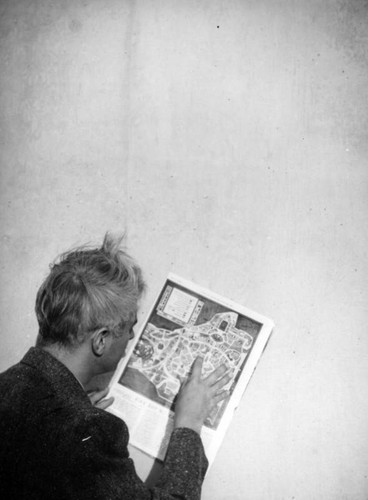 Herman Schultheis reads a map