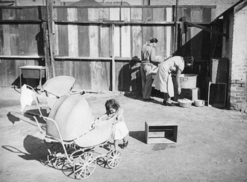 Doing laundry in the Santa Cruz Adobe courtyard