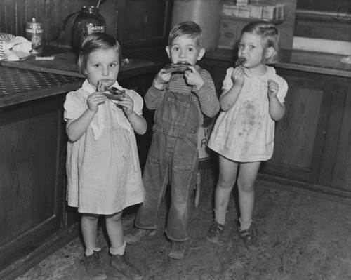 Orphan children eating