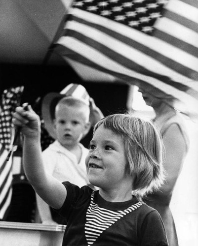 Lisa buys flag for celebration